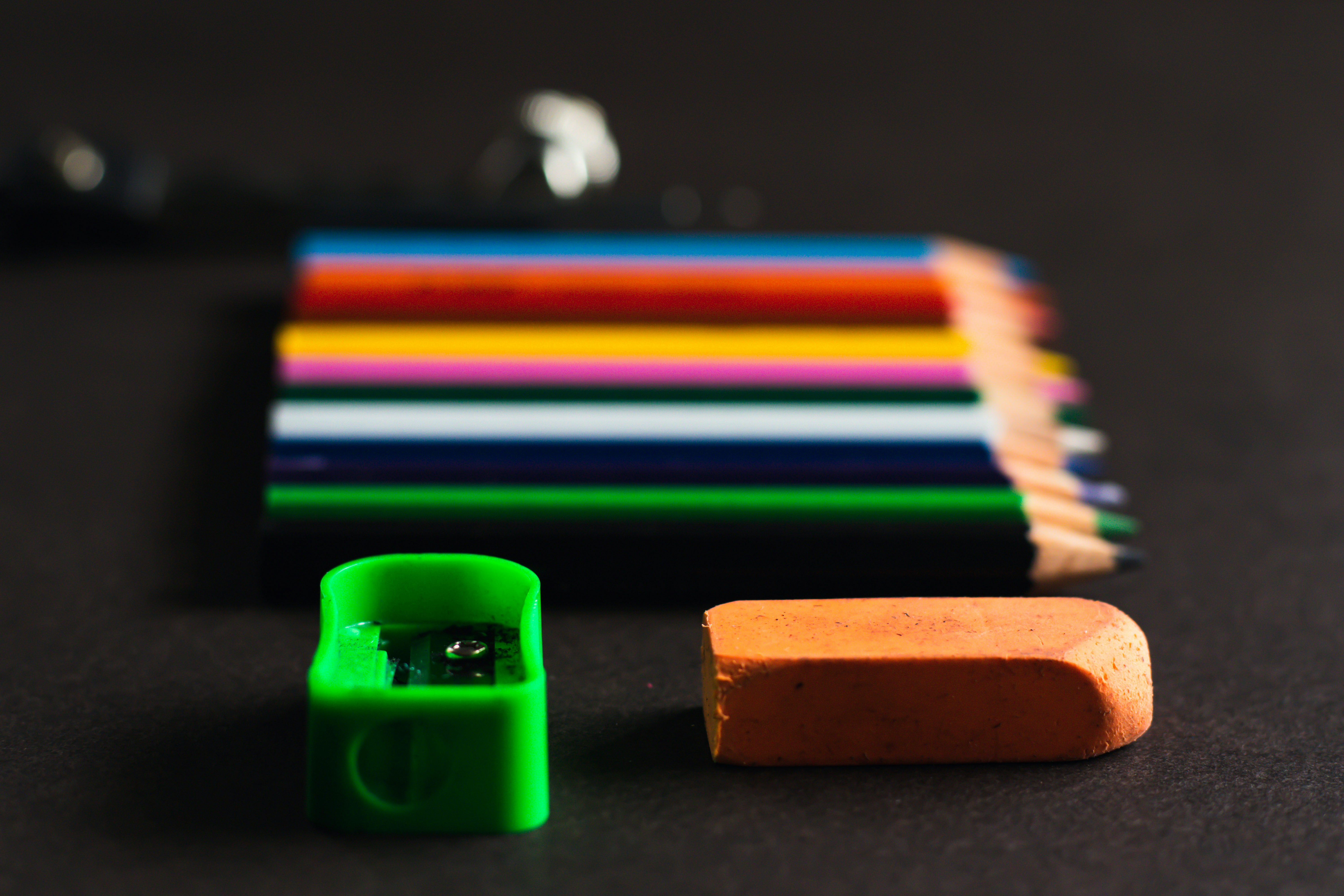 Colored pencils with an eraser and pencil sharpener
