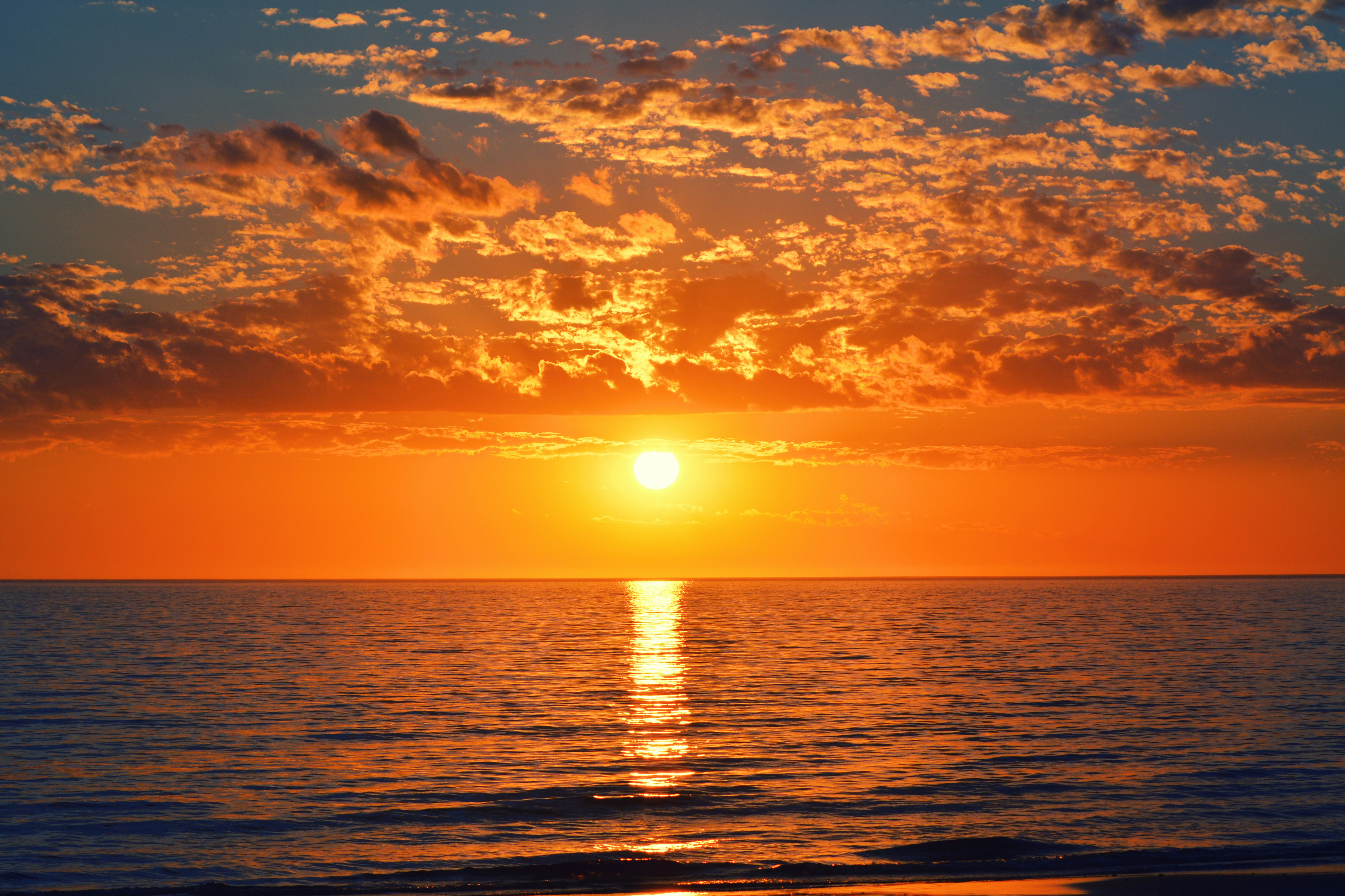 Ocean and clouds in golden hour light