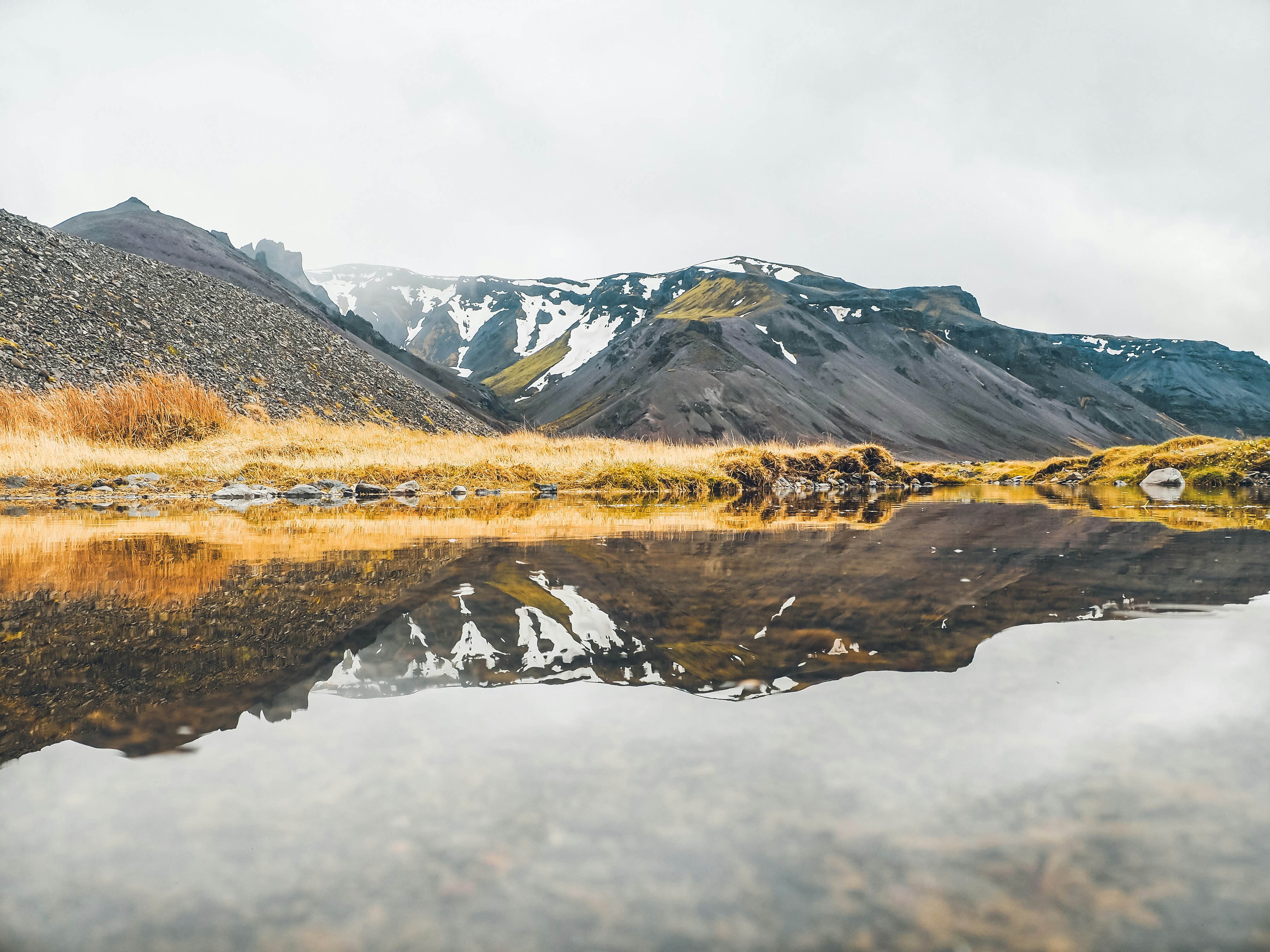 Hill reflected in a calm lake
