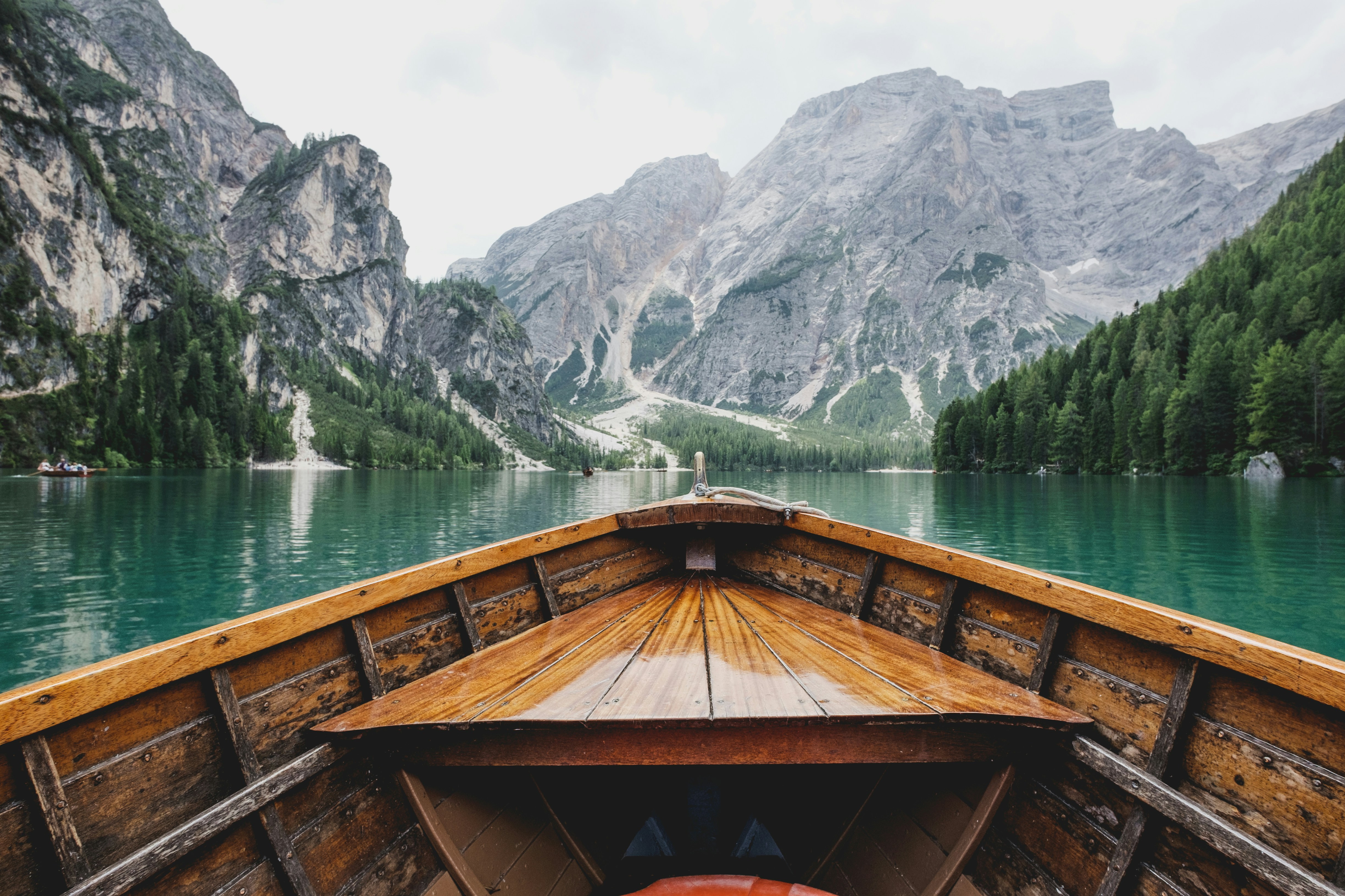 Small boat navigating a mountain river passage